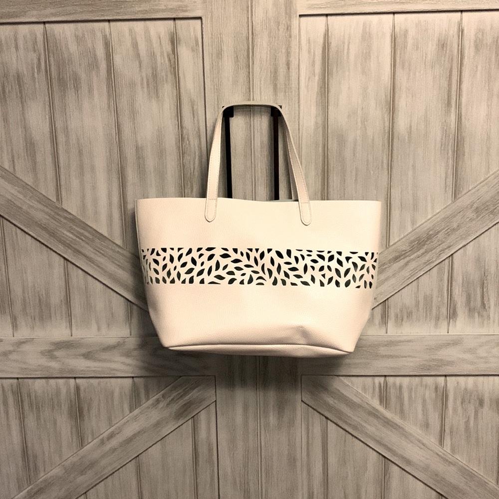 White shoulder bag with cut out details